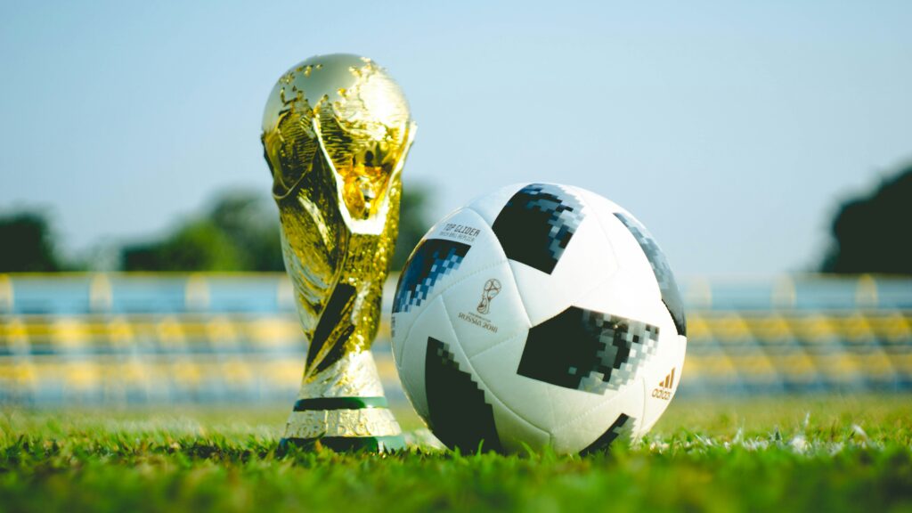 https://unsplash.com/photos/gold-colored-trophy-and-soccerball-cjYQBSKDSII